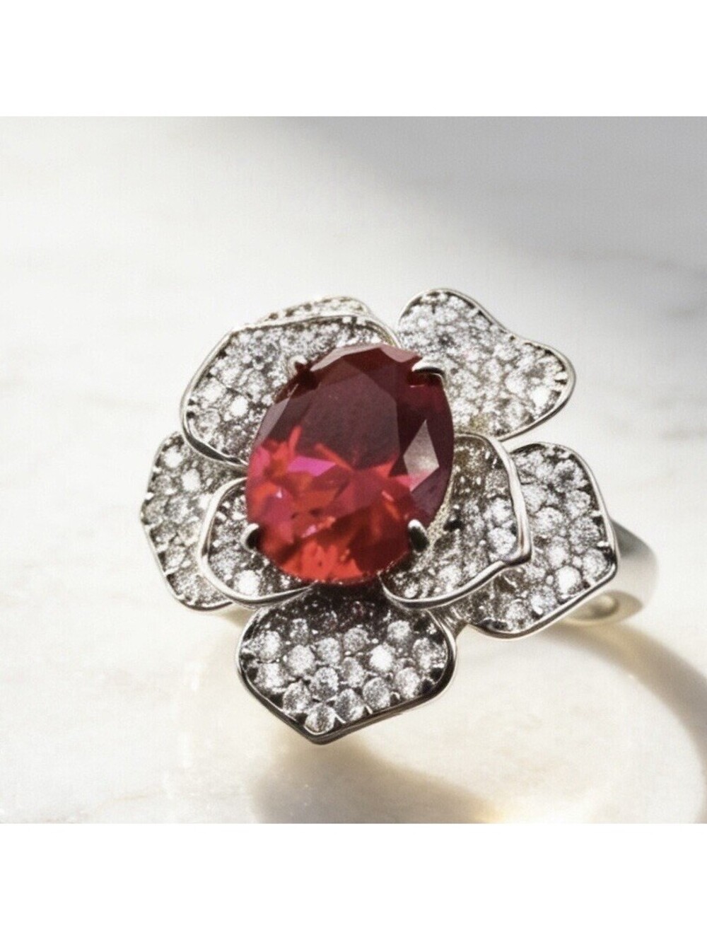 Elegant Silver Flower Ring with Red Gemstone Center